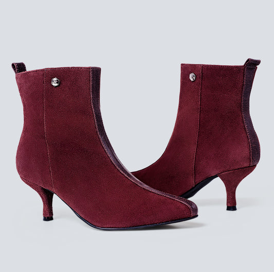 Botines en cuero lineal vino