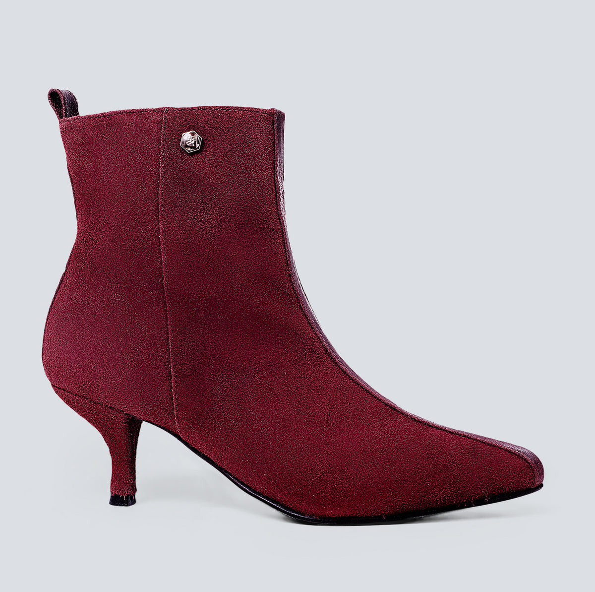 Botines en cuero lineal vino