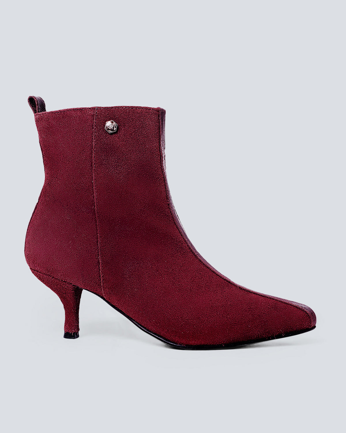 Botines en cuero lineal vino